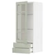 Armoire de cuisine moderne : METOD avec portes en verre vert stensund, cadres blancs, étagère réglable, tiroirs à fermeture douce. Design élégant et vertical.