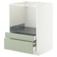 Un meuble de cuisine METOD blanc avec des tiroirs en stensund vert. L’armoire est rectangulaire et les tiroirs sont partiellement retirés.