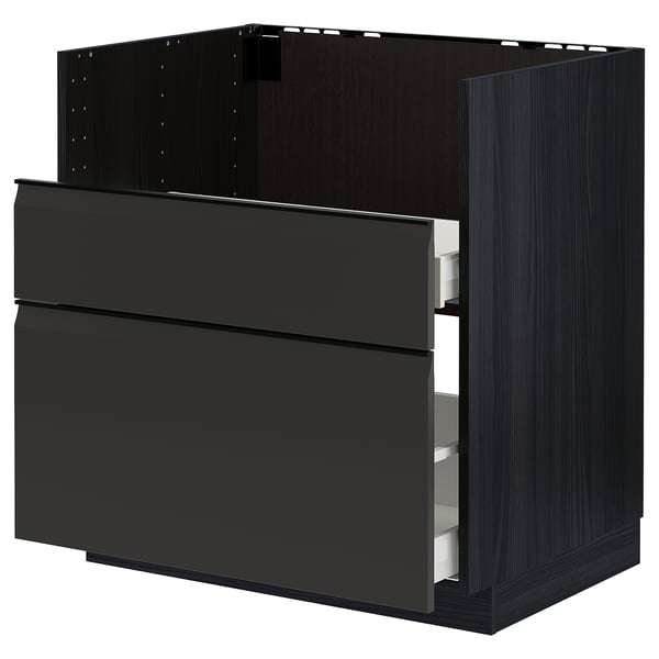 Armoire de cuisine noire moderne avec des poignées et des tiroirs élégants.