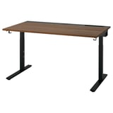 Le bureau assis-debout MITTZON avec un plateau en bois et des pieds noirs, conçu pour être réglable en hauteur.