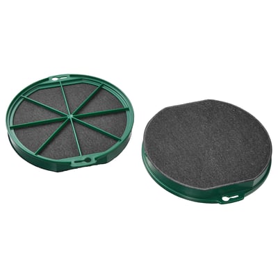 Deux filtres à charbon ronds verts, l’un divisé en sections.
