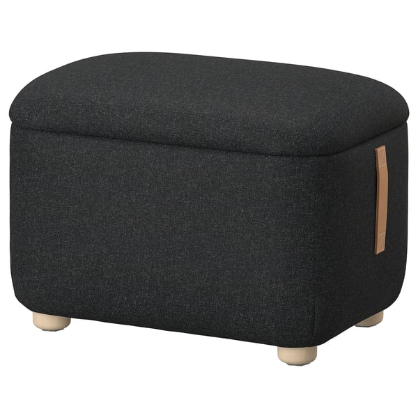 Tabouret en tissu gris foncé Oskarshhamn. Design arrondi avec poignée en cuir et pieds en bois.