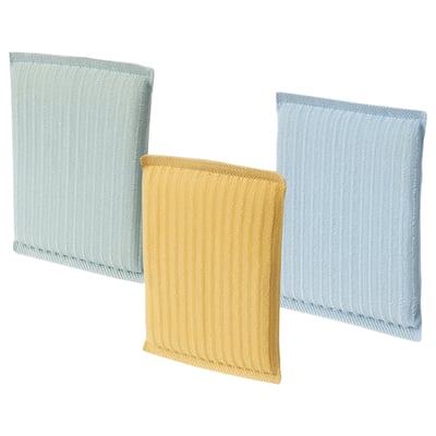 Trois éponges à récurer colorées en bleu et jaune, en forme de rectangle avec des surfaces texturées, disposées en rangée.