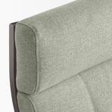 Coin du fauteuil recouvert de tissu, rembourrage doux, cadre en bois robuste.