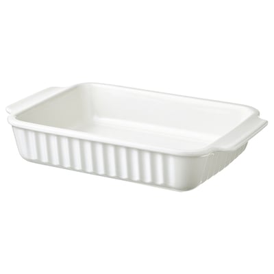 Un plat de cuisson oblong blanc avec poignées, en grès, conçu pour diverses cuissons.