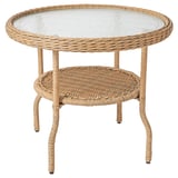 Table d’appoint RISHOLMEN : plateau en verre beige, osier et transparent, ronds, pieds ondulés, résistant aux intempéries.