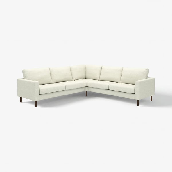 Un canapé d’angle SALTSJÖBADEN blanc cassé au design minimaliste, doté de ressorts de poche confortables et de housses amovibles lavables.