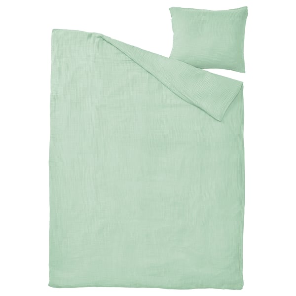 Parure de lit SCHERSMIN en mousseline de coton biologique vert clair à texture ondulée.
