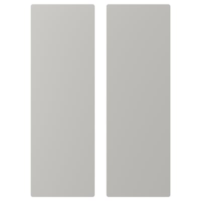 Deux panneaux gris clair, rectangulaires, aux bords légèrement arrondis, l’un légèrement décalé par rapport à l’autre.