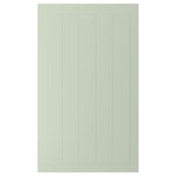 Une porte d’armoire STENSUND verte avec des rainures verticales et une finition lisse.