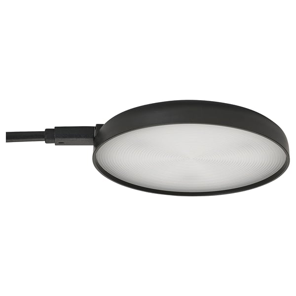 Vous avez un spot STRIMSÄV noir élégant avec une forme ronde et un design concentrique, parfait pour l’éclairage des armoires.