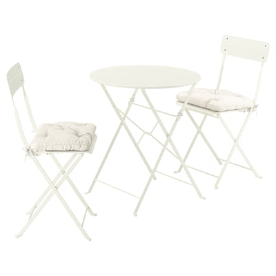 Ensemble d’extérieur blanc, comprend une table et des chaises rembourrées, se replie.