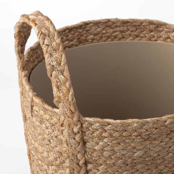 Panier à plantes en jute et coton tissé à la main avec des poignées robustes, mettant en valeur une texture naturelle et un savoir-faire de qualité.