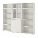 Unité de rangement TONSTAD blanc cassé avec étagères, armoires et portes coulissantes en verre.