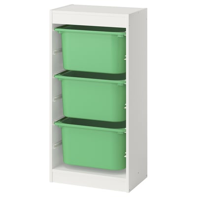 Une unité de rangement ikea TROFAST blanche avec des bacs en plastique verts. Son étagère rectangulaire multi-étagères est conçue pour organiser les articles des enfants.