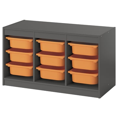 Unité de stockage TROFAST en gris avec neuf bacs en plastique orange/brun.
