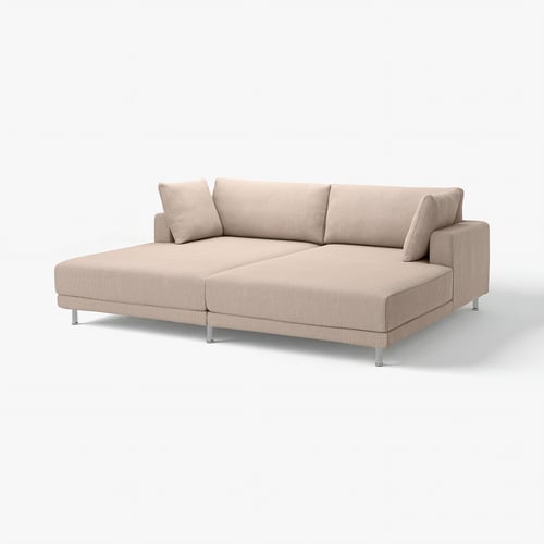 Canapé sectionnel beige UPPÅKRA avec des lignes épurées, de grands coussins et des pieds chromés robustes.