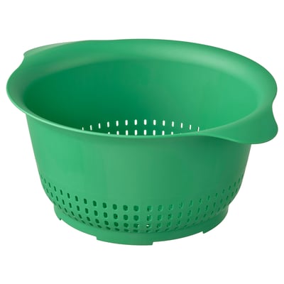 Passoire UPPFYLLD verte, en plastique, ronde avec poignées latérales.