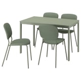 Un ensemble de salle à manger vert avec une table rectangulaire et quatre chaises assorties avec des pieds en métal et des sièges rembourrés.