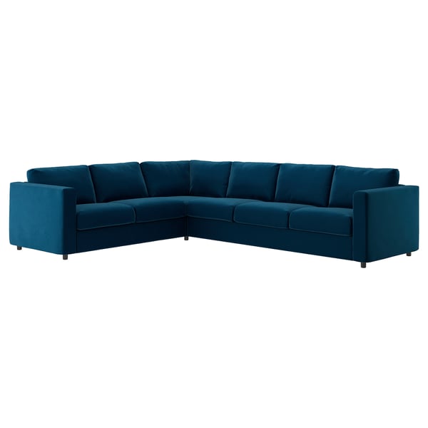 Un canapé sectionnel VIMLE sarcelle au design moderne, à la forme incurvée et au tissu semblable au velours.