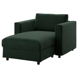 Un canapé en velours vert VIMLE avec une chaise longue de rangement.
