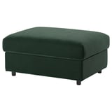 Un repose-pieds vert VIMLE avec rangement, conçu avec un revêtement en velours doux, une forme rectangulaire et des pieds noirs.