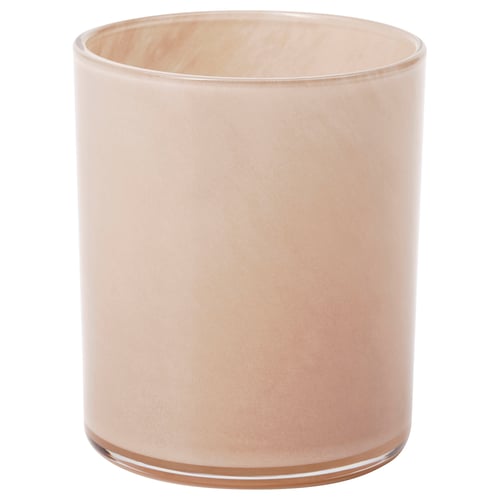 Bougeoir cylindrique en verre de couleur pêche.