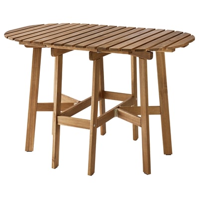 Een houten buitentafel van ASKHOLMEN in bruin. Het is rond met uitklapbare klapbladeren en stevige acaciahouten poten.