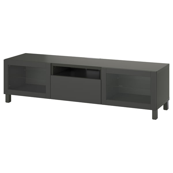 Zwart BESTÅ tv-meubel; Strak, rechthoekig, met glazen deuren en centrale lade voor opslag, modern design.