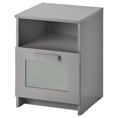 Grijze BRIMNES bijzettafel met open bovenplank, enkele lade en glazen voorpaneel.