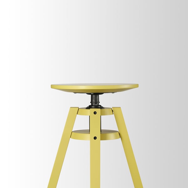 Gele in hoogte verstelbare kruk met ronde zitting, stevige metalen poten, hoogwaardig design.