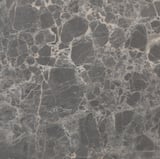 Donker, gestructureerd werkblad met ingewikkelde, wervelende patronen, waarschijnlijk een laminaatmateriaal, dat een hoogwaardig, duurzaam keukenoppervlak illustreert.