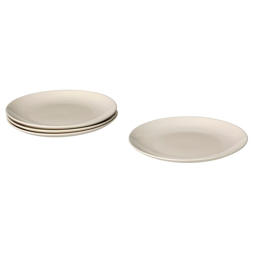 Set van eenvoudige, beige keramische eetborden, gestapeld in vieren, eenvoudig ontwerp.