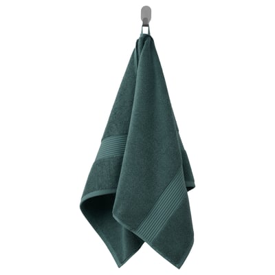 Een donkergroene, dikke FREDRIKSJÖN handdoek, gemaakt van 100% katoen met een decoratieve geweven rand.