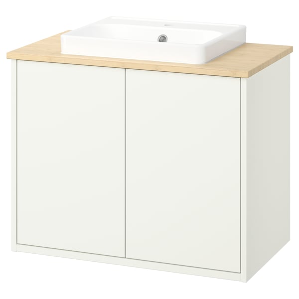 Witte HAVBÄCK badkamerkast met bamboe aanrecht en wastafel.