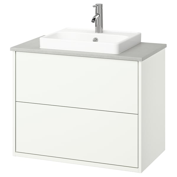 Witte HAVBÄCK badkamermeubel, modern design met lades, strak aanrechtblad en chromen kraan.