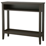 Een donkerhouten IDANÄS consoletafel met een rechthoekig blad, centrale open opbergruimte en een onderste plank. Elegant en functioneel voor smalle ruimtes.