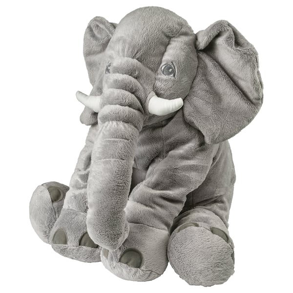 Olifant pluche speelgoed, grijs, zacht, groot, zittend, vriendelijk gezicht, slappe oren, witte slagtanden.