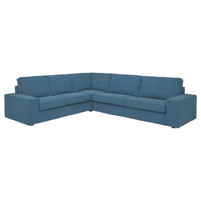 Teal blauwe KIVIK sectionele bank met diepe zittingen en lage armleuningen.