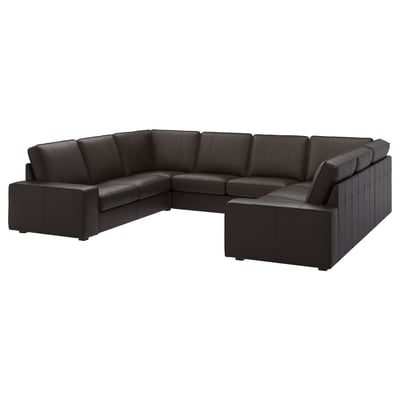 Grote zwart lederen sectionele bank, modern design met lage armleuningen, ideaal om te ontspannen.