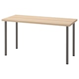 LAGKAPTEN tafel. Licht houten blad, zwarte metalen poten. Eenvoudig, modern, rechthoekig ontwerp.