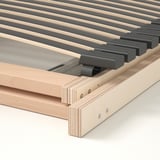 Close-up van houten lattenbodem Zichtbare verstelbare lamellen en solide frame met zichtbare schroeven.