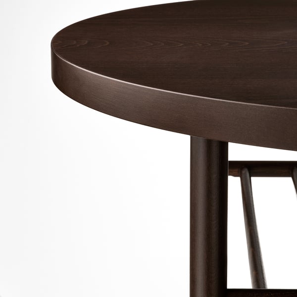 Donkere houten tafel close-up. Ronde randdetails, gladde afwerking en stevige kwaliteit. Metalen drager zichtbaar, benadrukt vakmanschap.