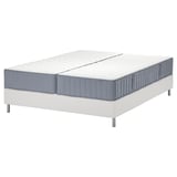 Deze afbeelding toont een moderne witte bedbodem met een gespleten, blauwgrijze matras met meerdere comfortzones en veerkernen.