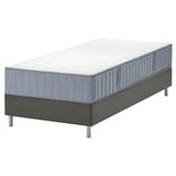 Modern bed met grijze LYNGÖR-matras, met 7 comfortzones op een grijze basis.