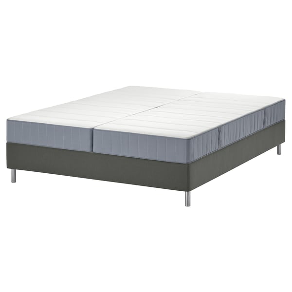 Verstelbare bedbodem met grijs frame en wit matras.