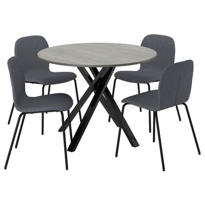 Ronde eethoek met grijze stoelen en tafel in betonstijl, strakke metalen poten.