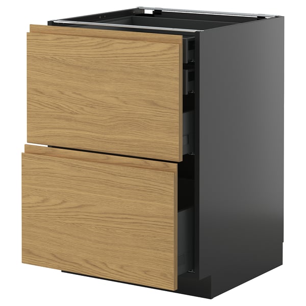 Een ikea METOD keukenkast met twee eikenhouten lades. Het is een minimalistisch ontwerp met een zwart frame en houten handgrepen.