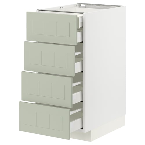 Een wit METOD keukenblok met vier groene lades, met veel opbergruimte in een modern, minimalistisch design.