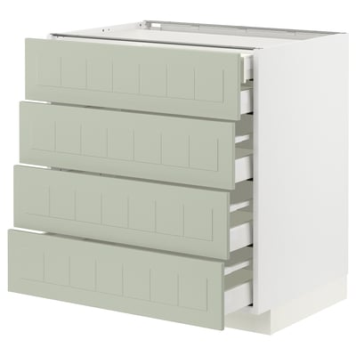 Een groene METOD keukenkast met vier lades en een wit frame, met een modern en functioneel design.